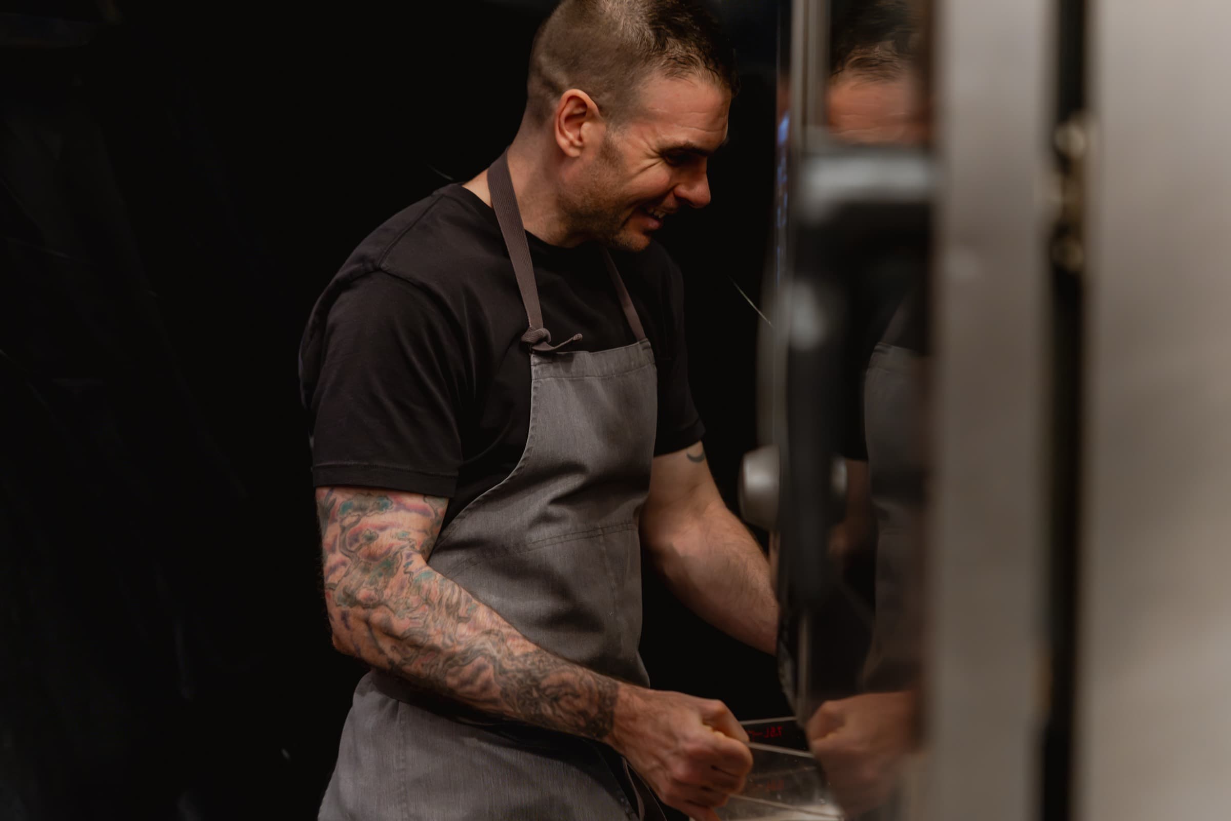 Chef Andrew Ashmore smiling in the kitchen