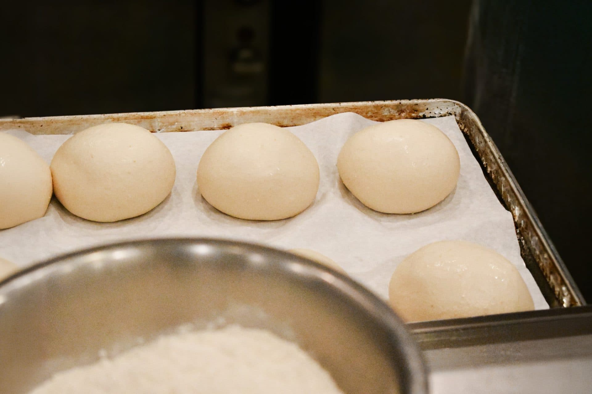 a plate of pizza dough balls